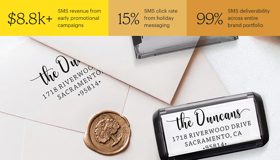 Black self-inking return address stamp sits atop addressed white envelopes and a gold wax seal on a white surface. Stats above image are: $8.8k+ SMS revenue from early promotional campaigns, 15% SMS click rate from holiday messaging, and 99% SMS deliverability across entire brand portfolio.