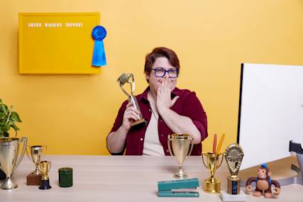 Mailchimp support team member accepting an award