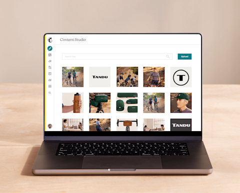 Laptop open to Mailchimp’s Content Studio filled with marketing assets.