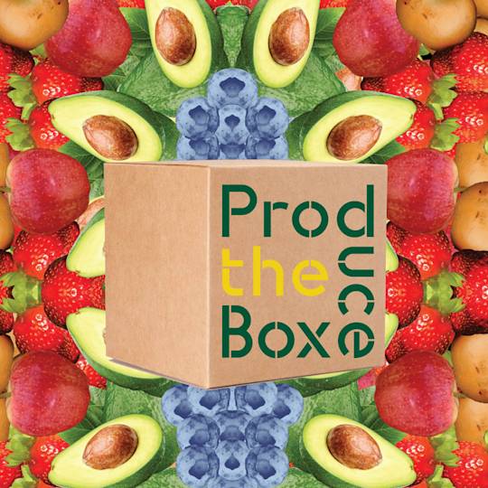 Brown cardboard box labeled "Produce Box" surrounded by fresh fruits including apples, avocados, strawberries, and blueberries
