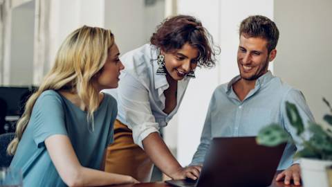 3 People looking at a laptop