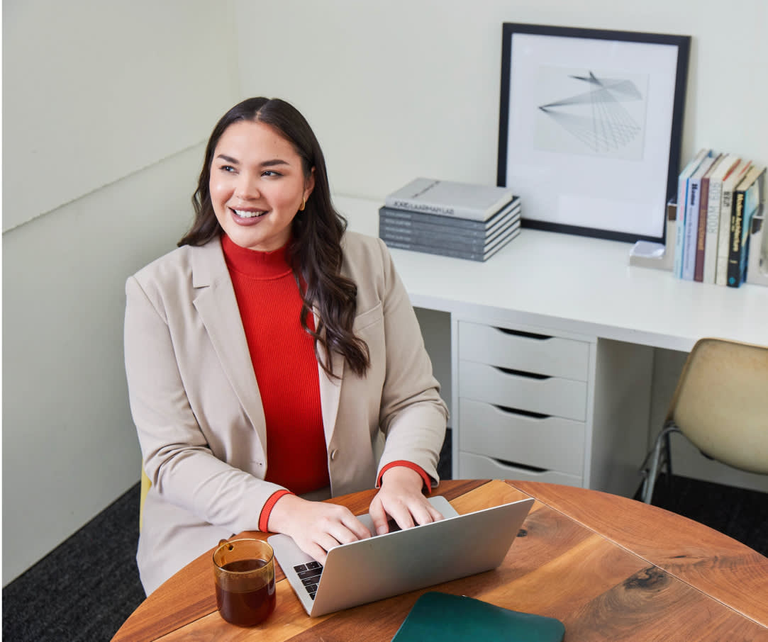An employee working at her desk