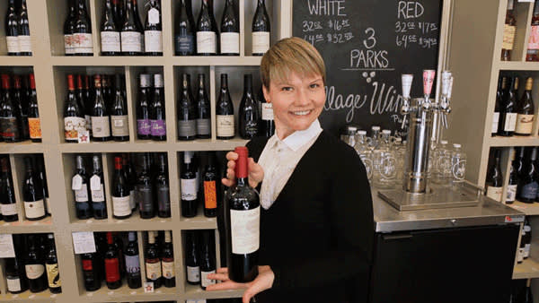 Melissa holding a bottle of wine