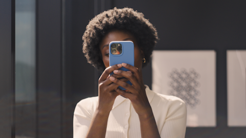 A woman looking at her phone