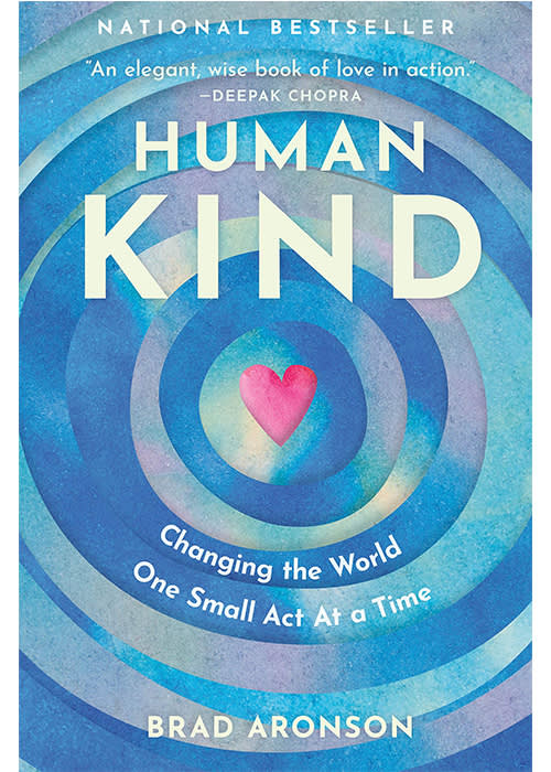 Book cover of "Human Kind" featuring concentric blue circles with a pink heart at center, subtitle about changing the world through small acts
