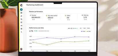 Marketing dashboard on laptop screen showing performance metrics and revenue trends with line graphs over 5-month period