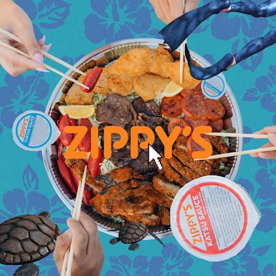 Overhead view of Zippy's plate with fried chicken, sausage, and sides, with multiple hands holding chopsticks reaching for food